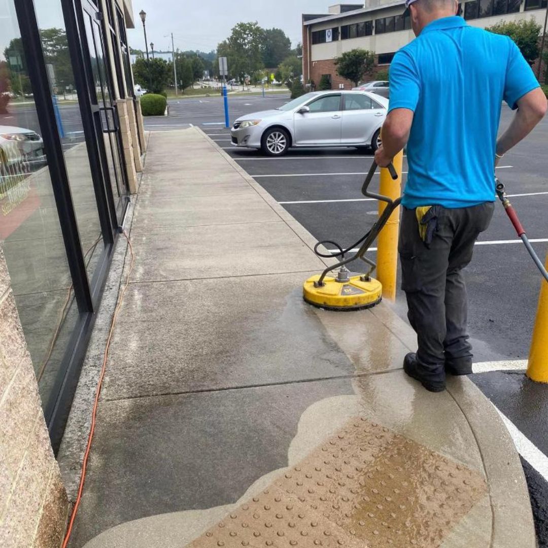 Surface cleaning a parking lot and a sidewalk